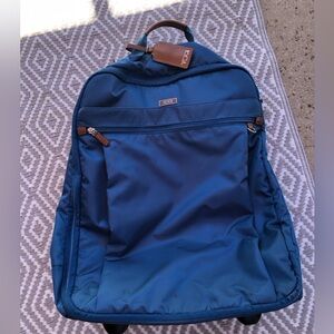Used Once, Tumi carry on roller suitcase, blue outside with orange inside